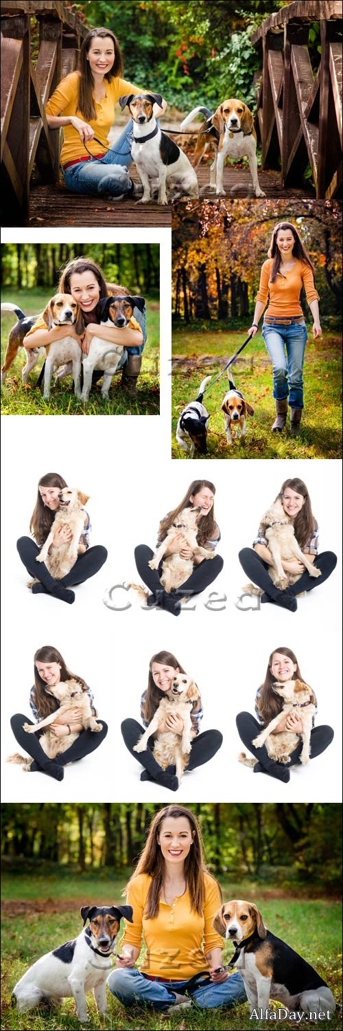 ������� � �������� / Woman with dogs in the forest - stock photo