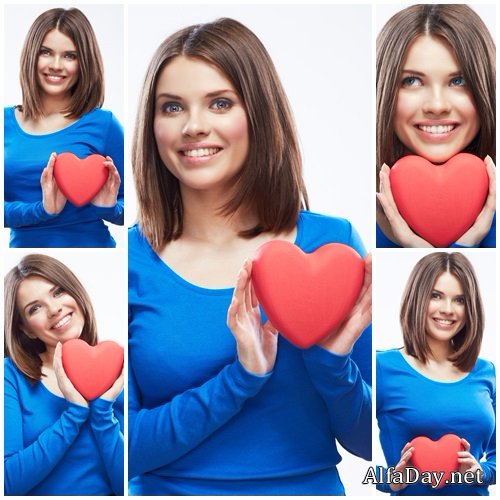Beautiful brunette woman with decorative red heart - stock photo