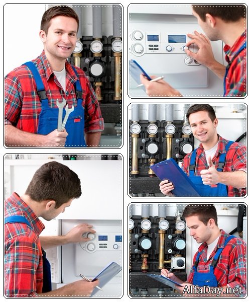 Technician servicing heating boiler - Stock Photo