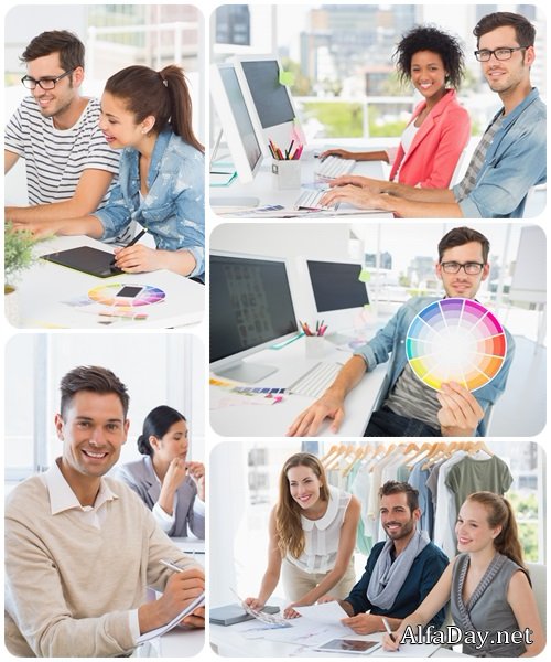Smiling casual young couple working on computers - Stock Photo