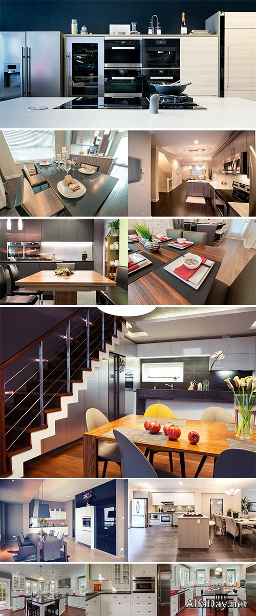 Stock Images Stylish new kitchen in white with black granite counter tops with stainless steel oven and fridge 