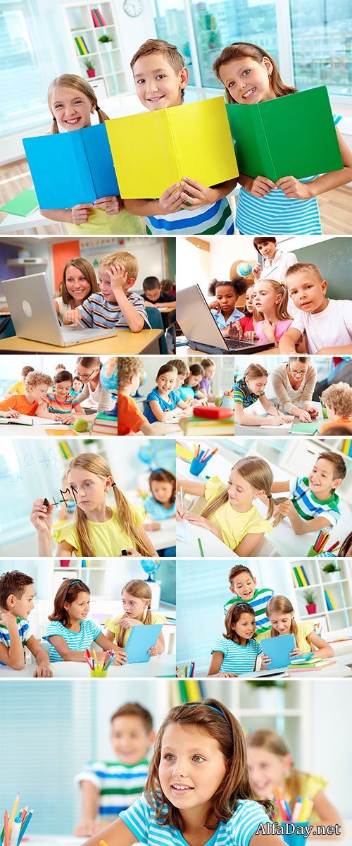 Stock Photos Portrait of happy classmates with multi-colored open books smiling at camera in classroom