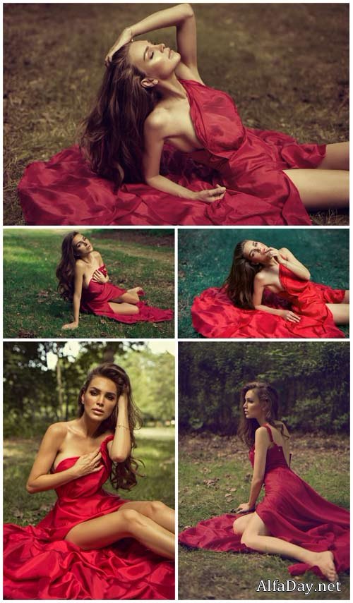 Charming girl in a crimson dress - Stock Photo