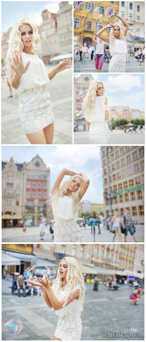 Beautiful blonde on a walk in the city - Stock Photo