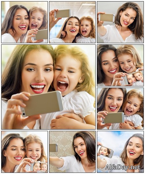 Mother and daughter with camera - Stock Photo