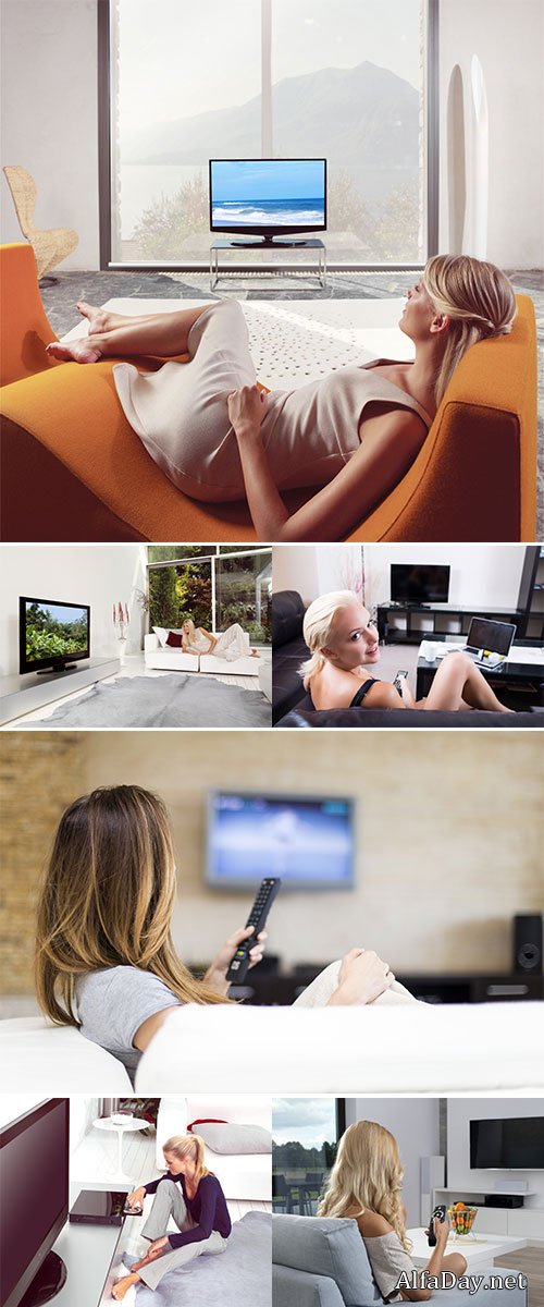 Stock Photo Beautiful blond woman sitting near tv and tries to connect compact chip