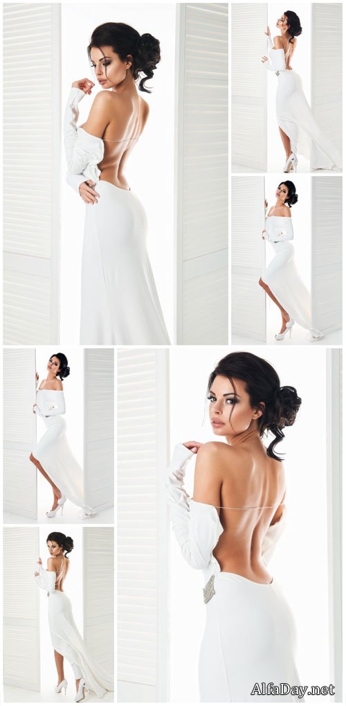 Charming girl in a long white dress - stock photos
