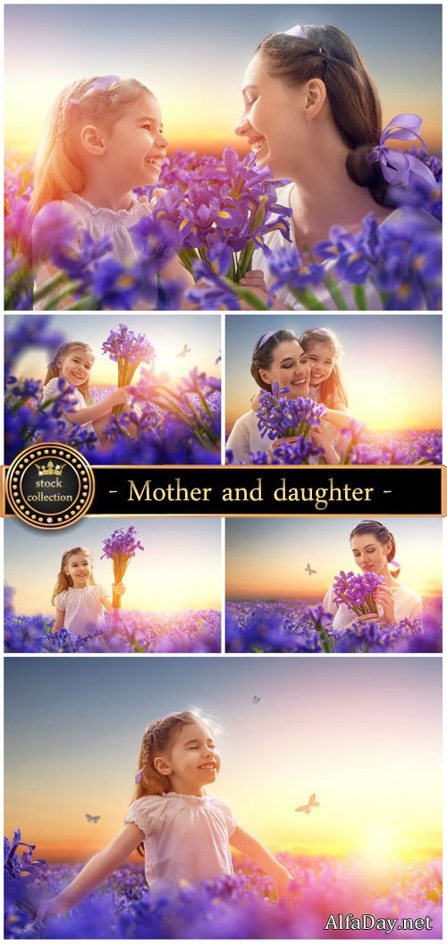 Mother and daughter on the field with iris - Stock Photo
