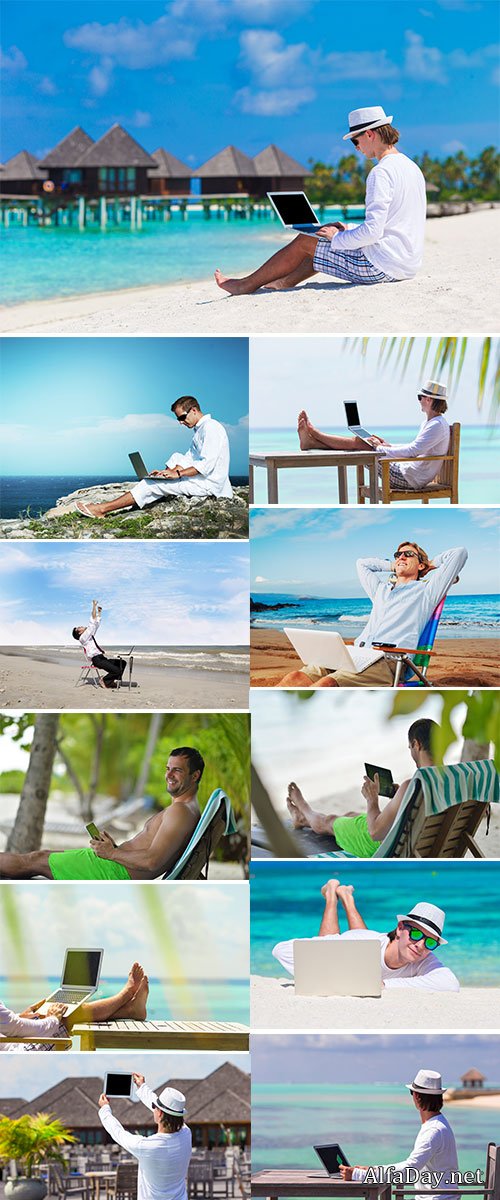 Stock Image Young man with tablet computer during tropical beach vacation
