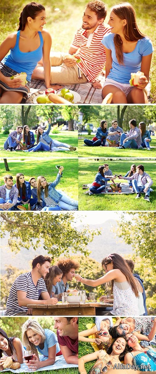 Happy friends on picnic in park  Stock Images