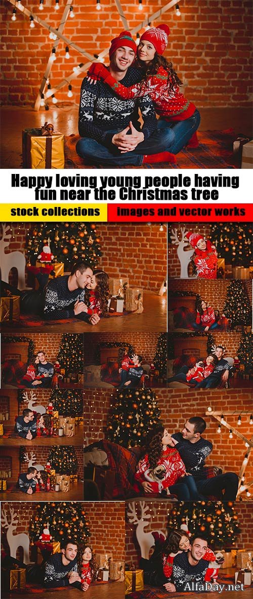 Happy loving young people having fun near the Christmas tree 