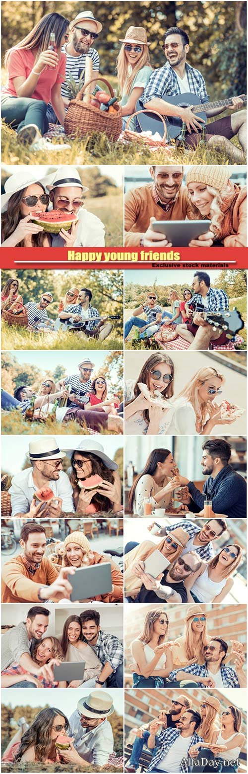 Happy young friends having picnic in the park
