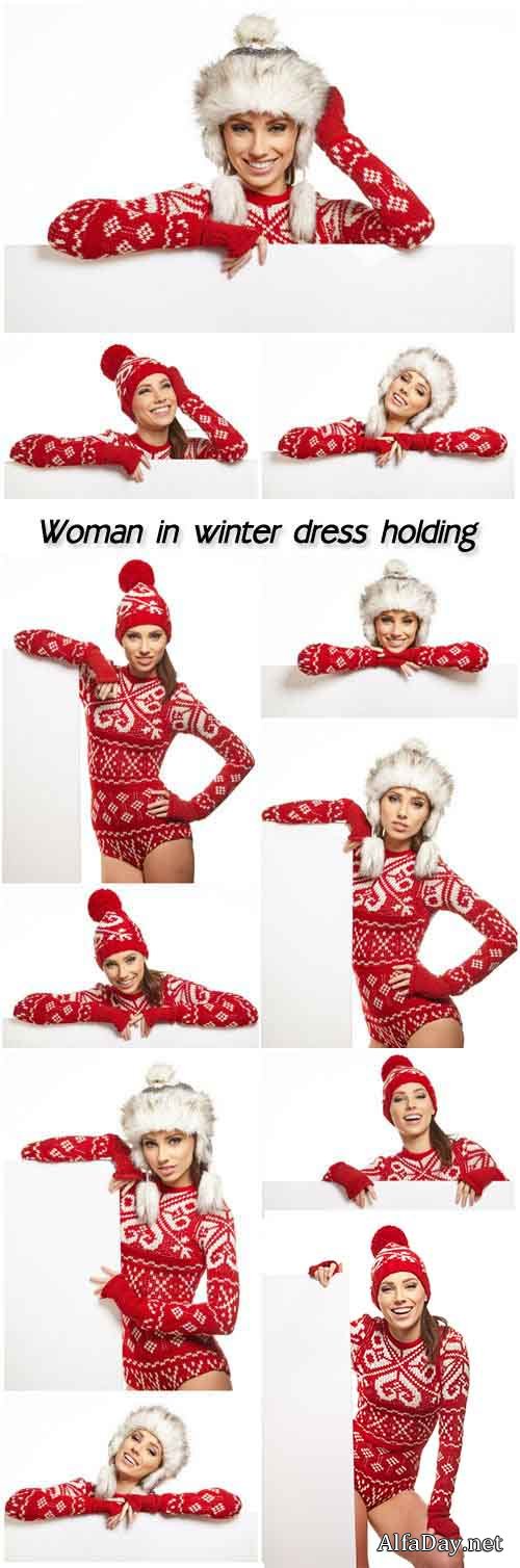 Woman in winter dress holding a blank billboard, white background