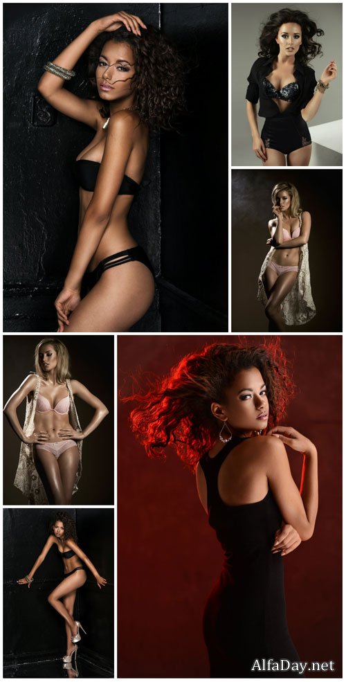 Girls posing in studio on black background stock photo